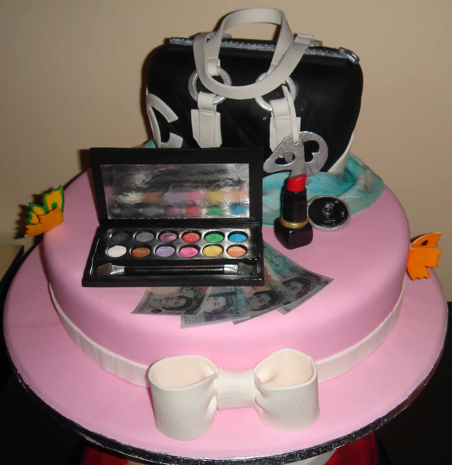 Handbag and make-up themed birthday cake